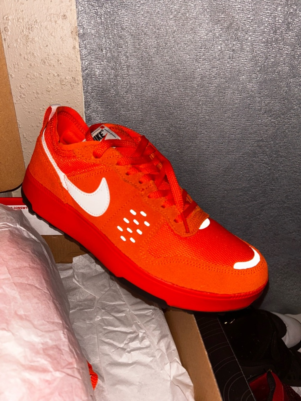 Nike Men’s Sneaker in Bright Orange with White Swoosh